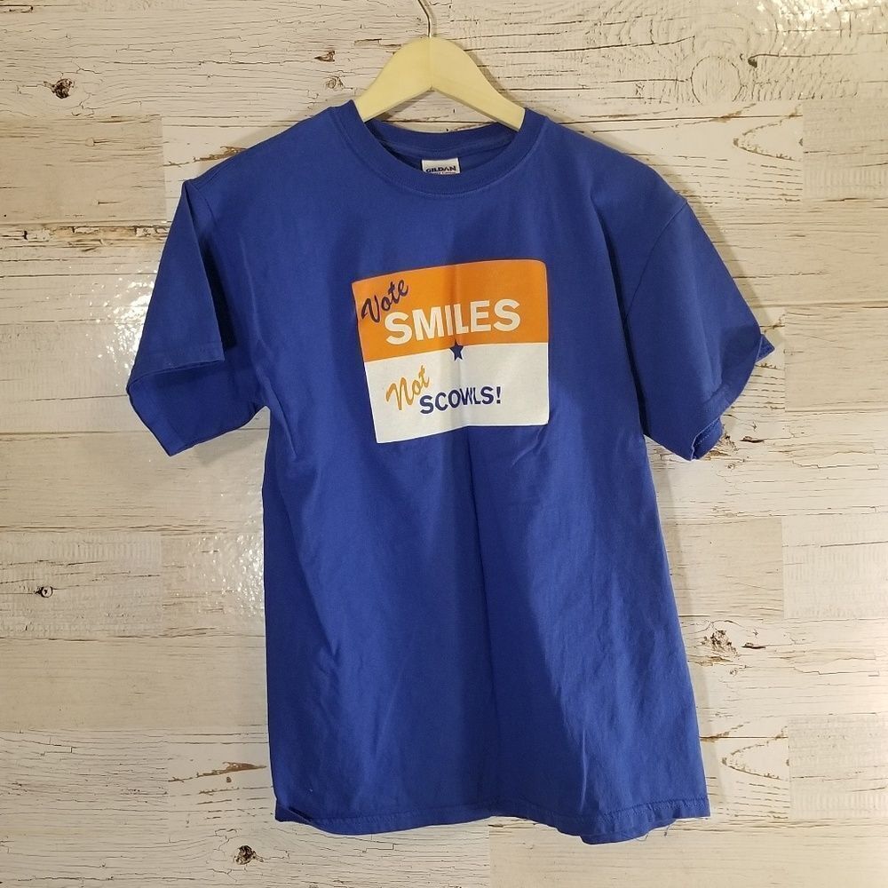 "Vote smiles not scowls" graphic tee